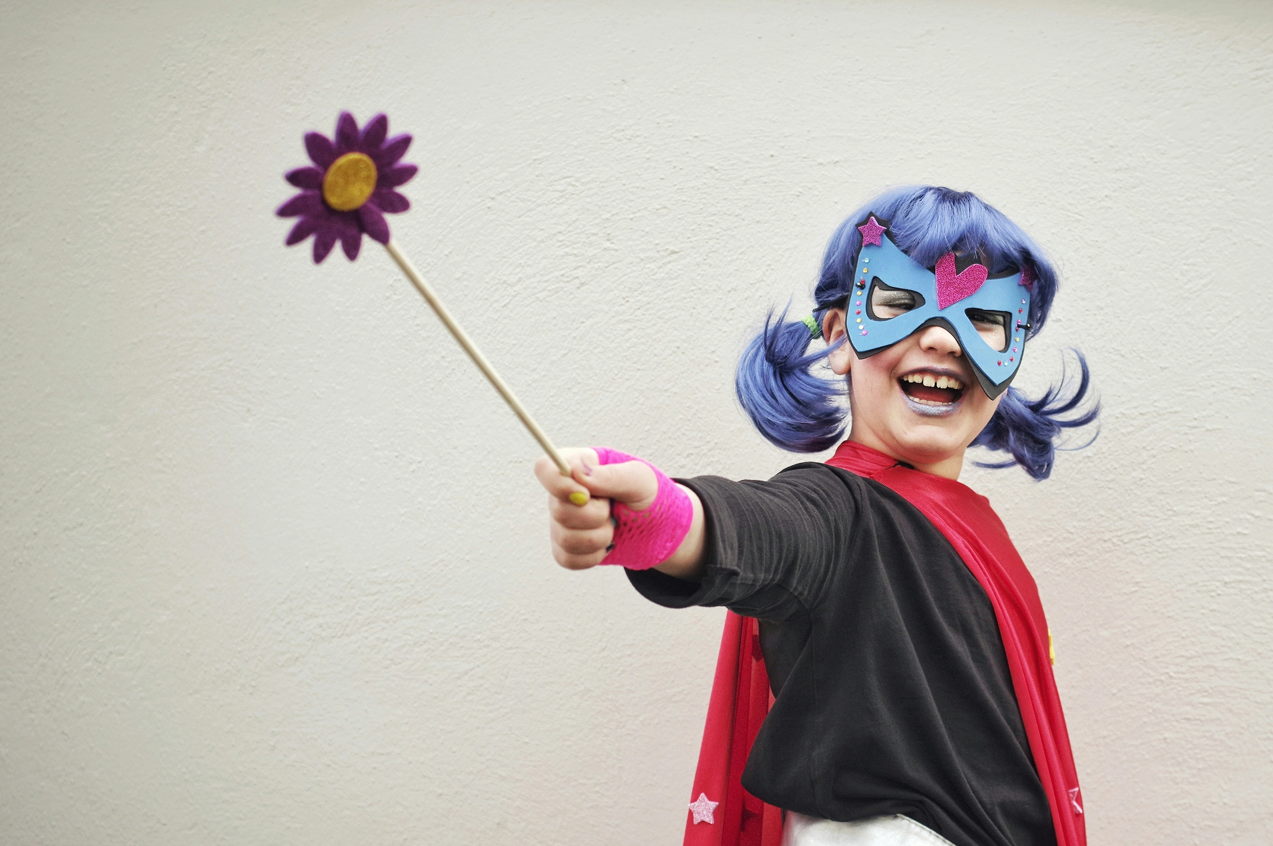 Young girl role-playing as a super hero