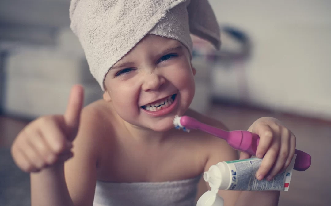 child practicing self-care by brushing teeth