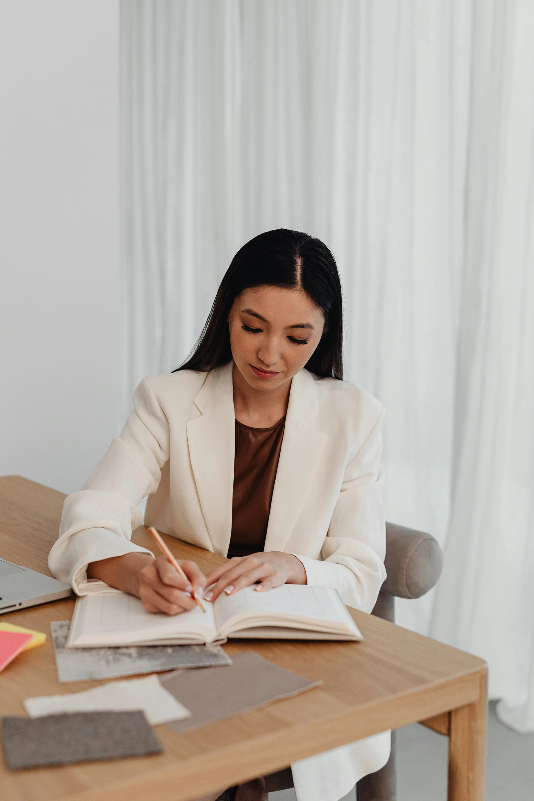 Woman writing her self-care routine for the week